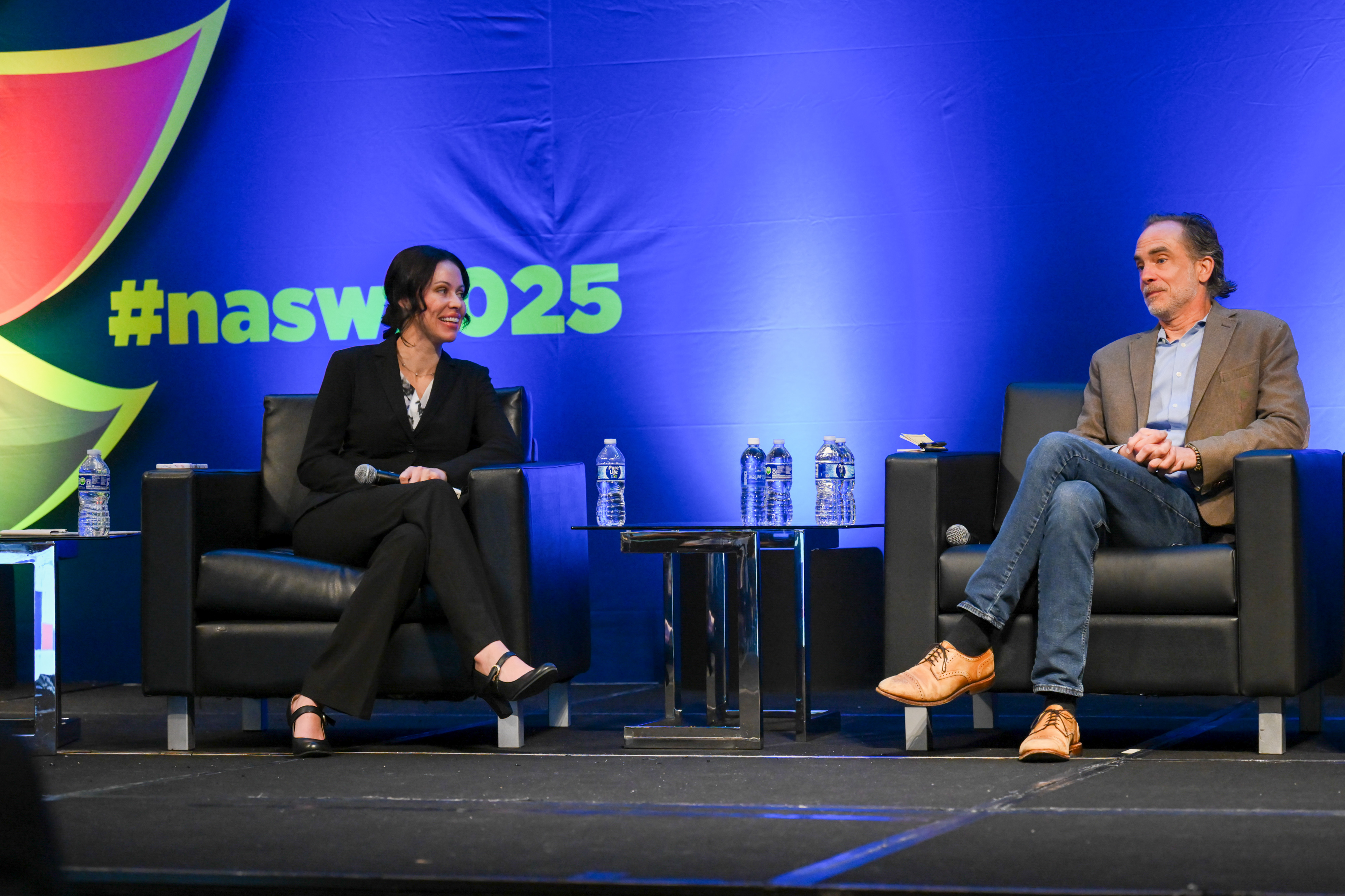 presenters onstage at conference